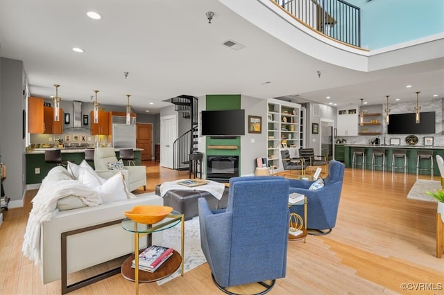 living room with light hardwood / wood-style flooring