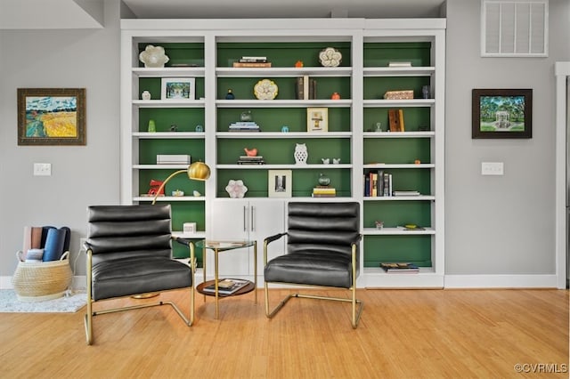 sitting room featuring hardwood / wood-style floors