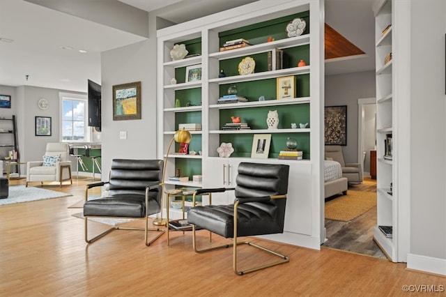 sitting room with light hardwood / wood-style floors