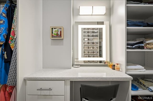 bar featuring light stone countertops