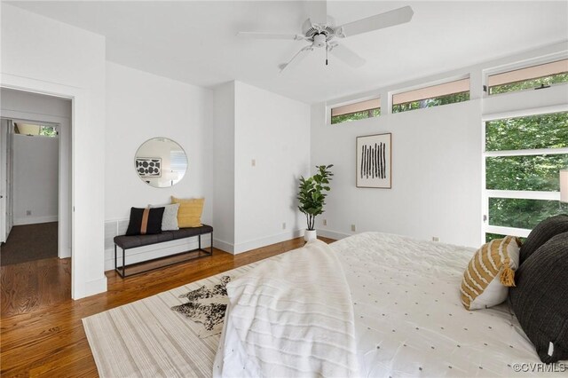 bedroom featuring ceiling fan and hardwood / wood-style flooring