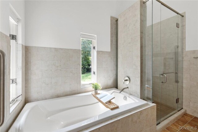 bathroom with separate shower and tub