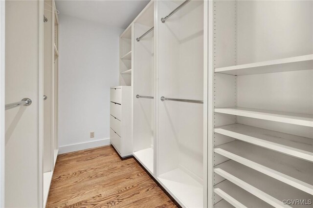 walk in closet featuring light wood-type flooring