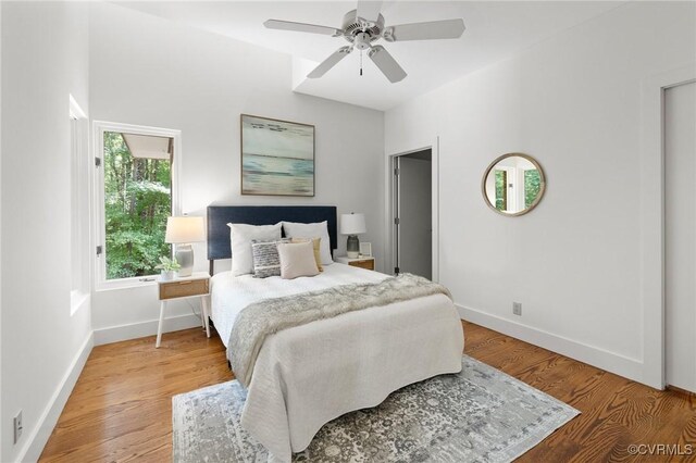 bedroom with wood-type flooring and ceiling fan