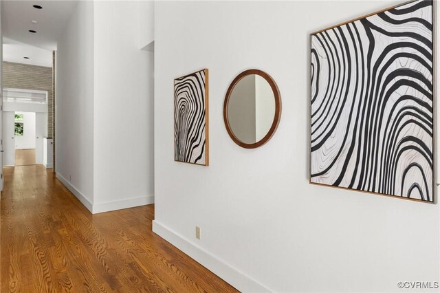 corridor featuring wood-type flooring