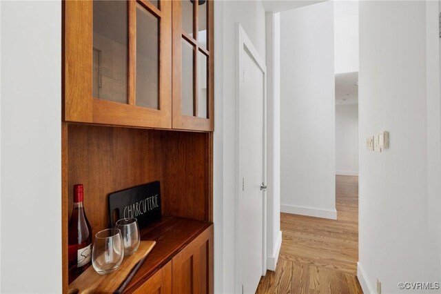 corridor featuring light hardwood / wood-style flooring