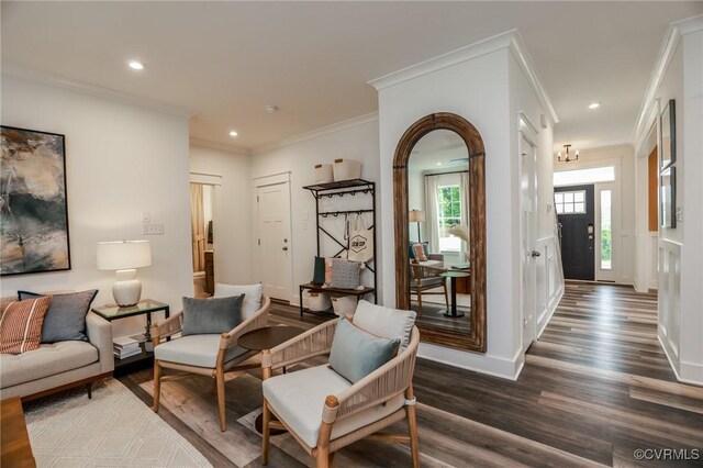 living room with ornamental molding and hardwood / wood-style flooring