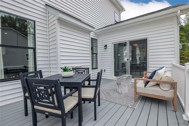 wooden deck with outdoor dining space