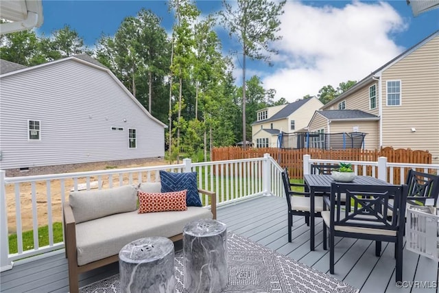 wooden deck featuring outdoor dining area and fence