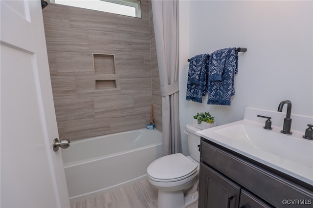 full bathroom featuring tile patterned floors, toilet, shower / tub combo with curtain, and vanity