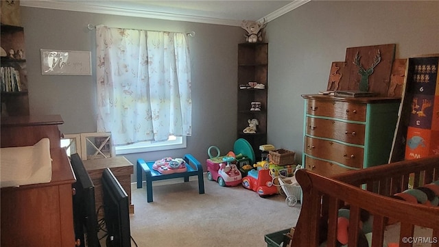 carpeted bedroom with a nursery area and crown molding