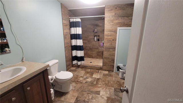 bathroom featuring vanity, toilet, and a shower with curtain