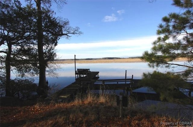 view of dock featuring a water view and boat lift