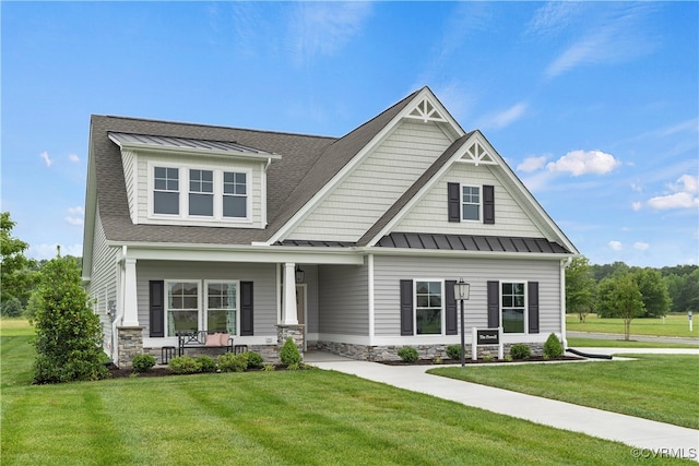 craftsman-style house with a front yard and covered porch