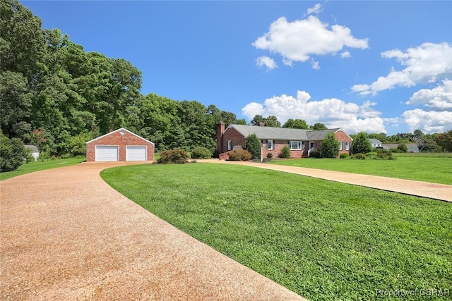 single story home featuring a garage, a front lawn, and an outdoor structure