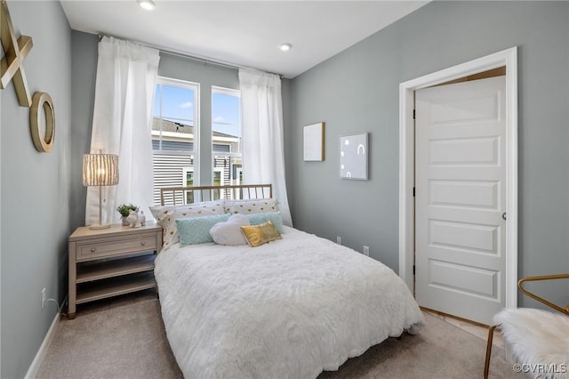 bedroom with carpet and baseboards