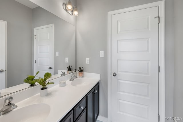 bathroom with double vanity and a sink