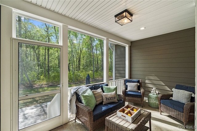 sunroom with wood ceiling and a wealth of natural light