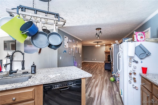 kitchen featuring dishwasher, hardwood / wood-style floors, ornamental molding, and white refrigerator