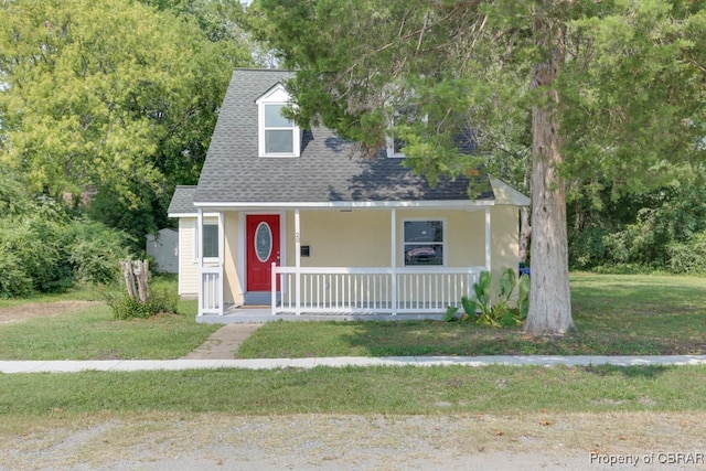 view of front facade with a porch and a front lawn