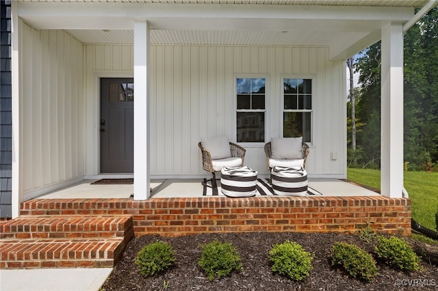 view of exterior entry featuring a porch