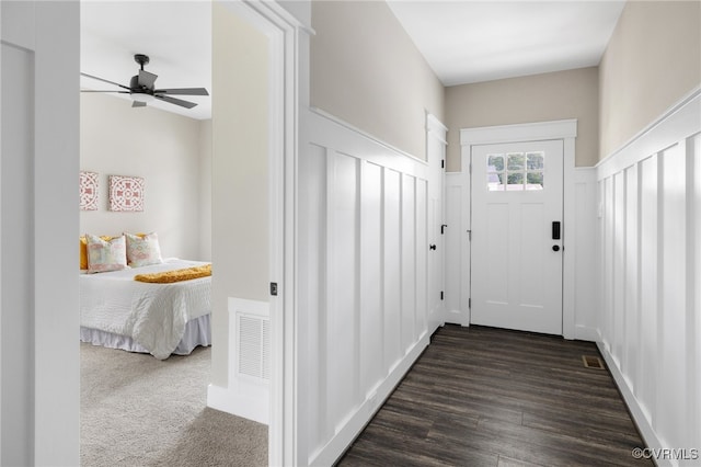 doorway to outside featuring dark hardwood / wood-style flooring and ceiling fan