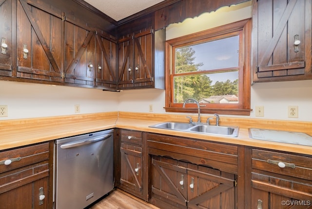 kitchen featuring stainless steel dishwasher, ornamental molding, sink, dark brown cabinetry, and light wood-type flooring