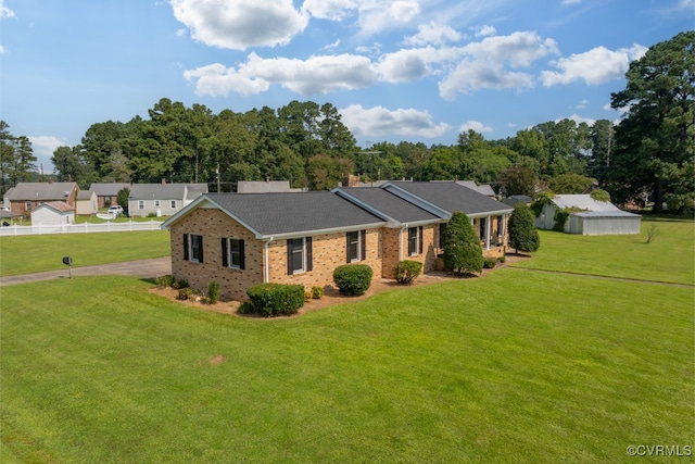 single story home with a front yard