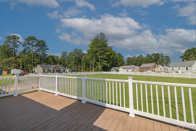 wooden deck with a yard