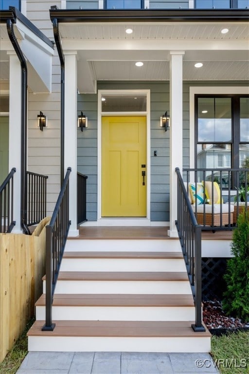 view of exterior entry with a porch