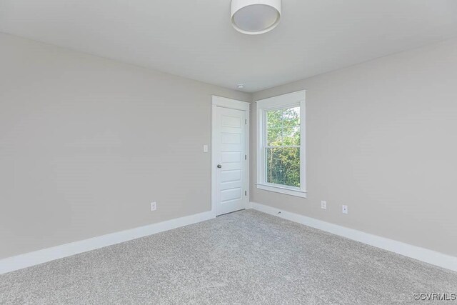 empty room with carpet flooring