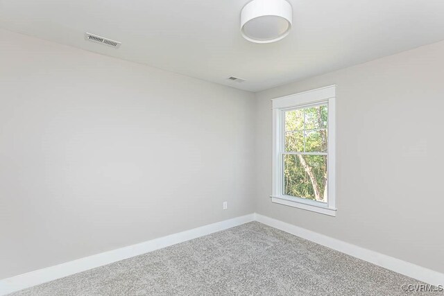 empty room featuring carpet floors