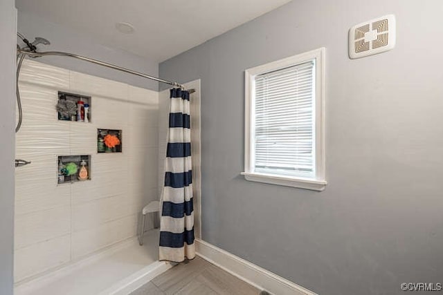 bathroom with a shower with shower curtain