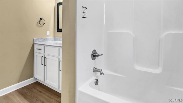 3323 Rock Creek Villa Dr, Quinton, VA 23141 - bathroom with vanity,  shower combination, baseboards, and wood finished floors