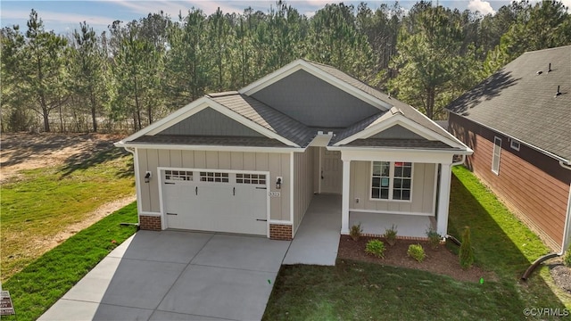 view of front of house with a garage and a front yard