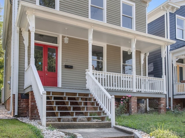 entrance to property featuring a porch