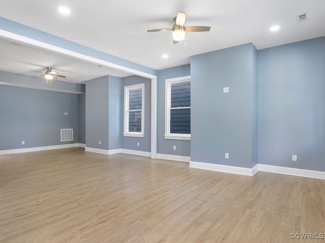 unfurnished room with ceiling fan and light hardwood / wood-style flooring