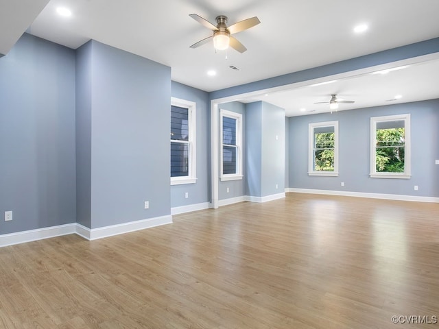 interior space with ceiling fan and light hardwood / wood-style floors