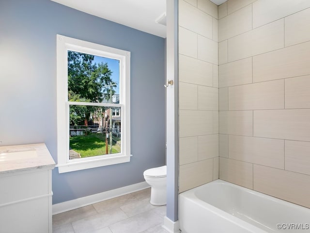 bathroom with vanity, toilet, and tile patterned floors