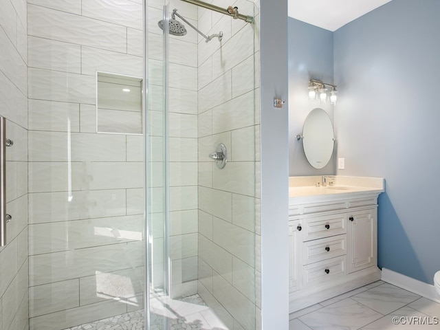 bathroom with vanity, toilet, and an enclosed shower