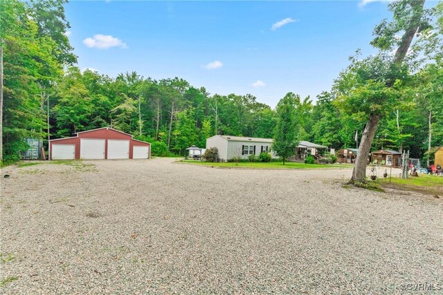 view of front of house featuring an outdoor structure and a garage