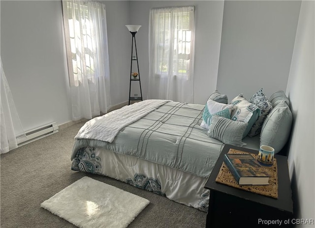 bedroom with carpet floors and baseboard heating