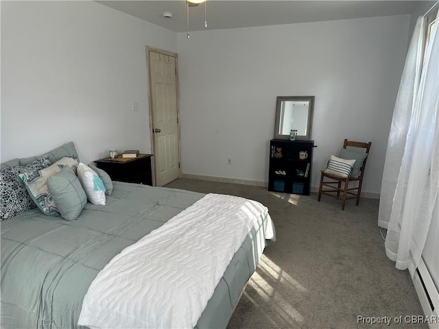 carpeted bedroom with baseboards