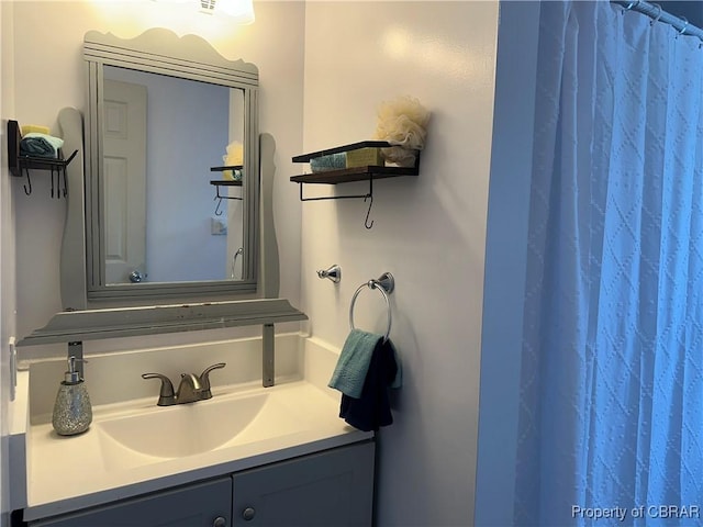 full bath with vanity and a shower with shower curtain