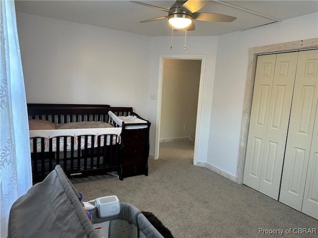 bedroom featuring a closet, carpet flooring, a ceiling fan, and baseboards