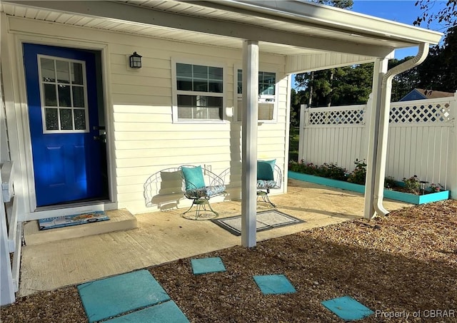 doorway to property with fence