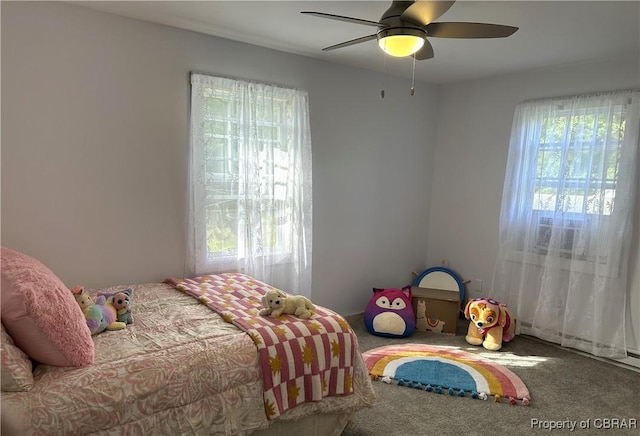 carpeted bedroom featuring ceiling fan