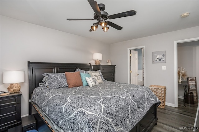 bedroom with connected bathroom, ceiling fan, and dark hardwood / wood-style floors