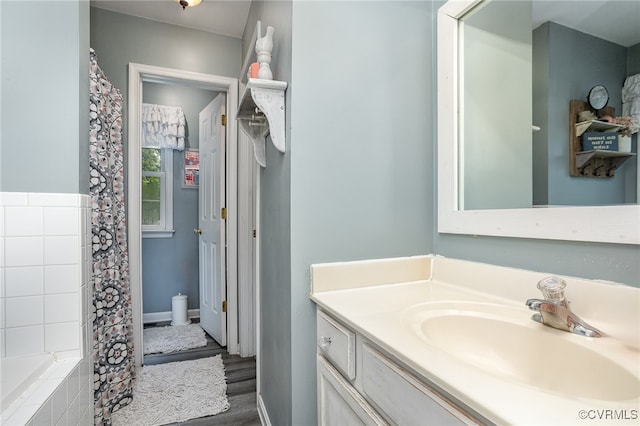 bathroom featuring vanity and wood-type flooring