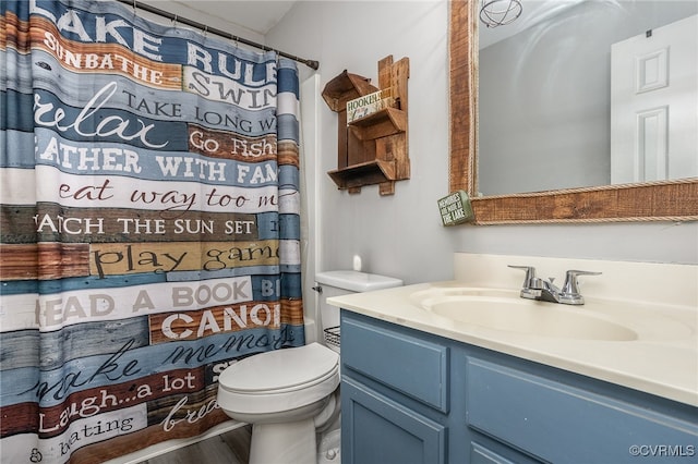 bathroom featuring a shower with shower curtain, vanity, wood-type flooring, and toilet